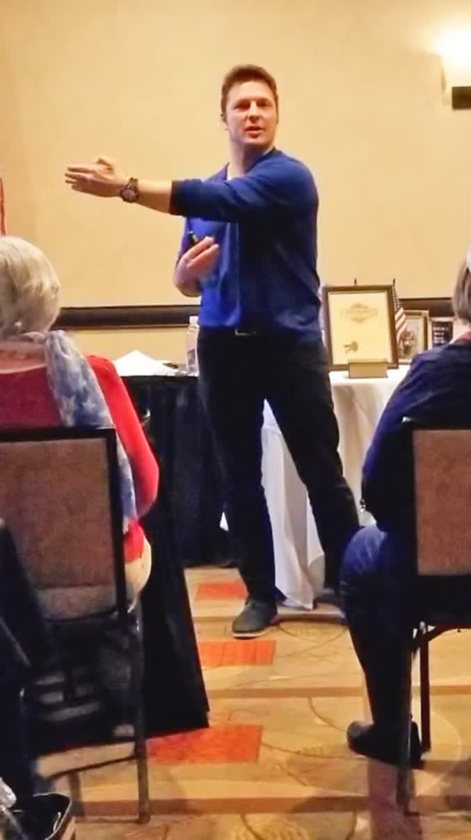 Zack Starr speaking to a small room of business owners